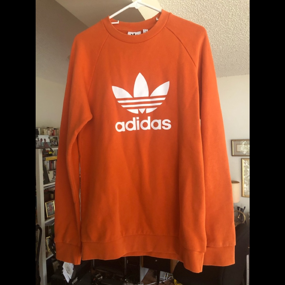Orange adidas long sleeve sweat shirt.